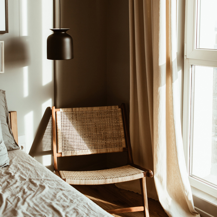 Rattan Chair by the Window of the Apartment